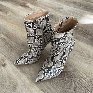 Beautiful snake skin heeled boots